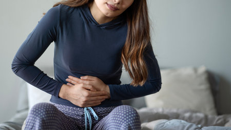 Woman suffering from stomach ache