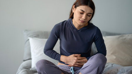Woman suffering from stomach ache