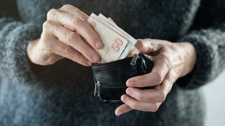 Hands taking out money from wallet