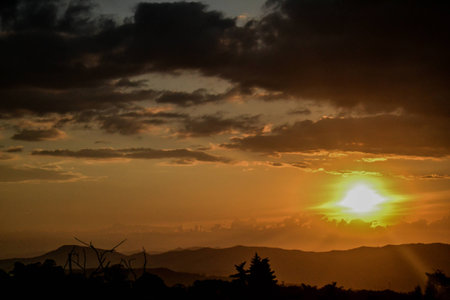 jungle sunset sky and mountainsの写真素材