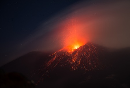 Eruption of the Etna volcano from the active central crater with lava explosionの写真素材