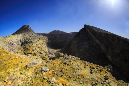 Etna volcano crater with yellow sulfur and blu skyの写真素材