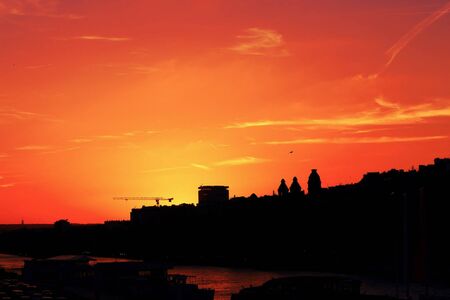 Sky Sunset colors on Senna River -Paris city in backlightの写真素材