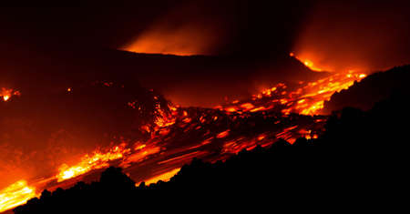 Great Lava Explosion during eruption on Etna volcano in the nightの写真素材