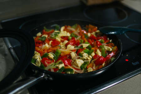 Frying pan with sauteed vegetables for Mexican food recipe. Bring peppers and onions.