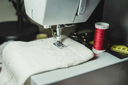Sewing machine sewing socksの写真素材