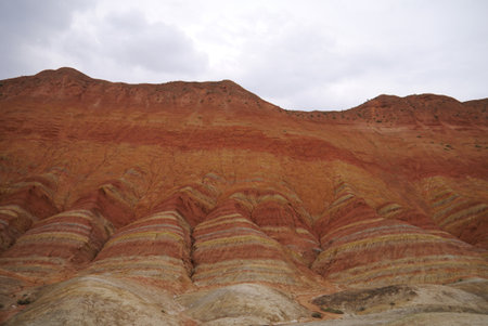 Here, the base of the Zhangye "Rainbow" mountains appear more like undulating fabric than rock.の写真素材