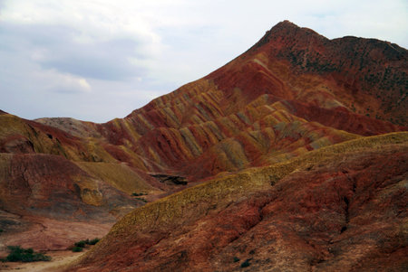 Here, the base of the Zhangye "Rainbow" mountains appear more like undulating fabric than rock.の写真素材