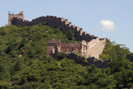Many parts of the Great Wall have been restored. Other sections, as here in the foreground, have been left in the state Time has created.の写真素材