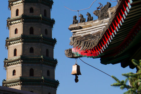 A view through one arched window to others; the octagonal floor plan and upturned roof corner are pillars of traditional Chinese architecture.のeditorial素材