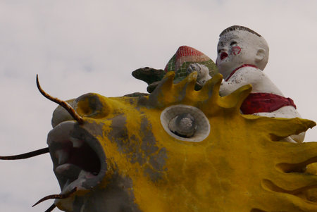 Hong Kong Tin Hau Temple Fish, with a baby holding a turtle.のeditorial素材