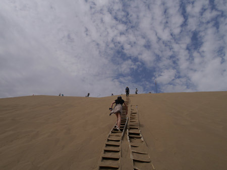 Climb the sand dunes of Mingsha Mountain near Dunhuang, Gansu Province for a glorious view of Yueyaquan, or Crescent Lake.のeditorial素材
