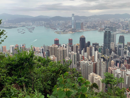 A mountainous series of islands, Hong Kong offers unparalled views. Victoria Peak is especially beautiful, overlooking Densely packed highrise buildings and Victoria Harbor.の写真素材