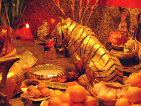 Los Angeles's Chinatown hosts a spectacular New Year. 2013 was the year of the snake.  Here, a temple overflows with offerings of fruit and money. Even the Tiger gets in on the act!のeditorial素材