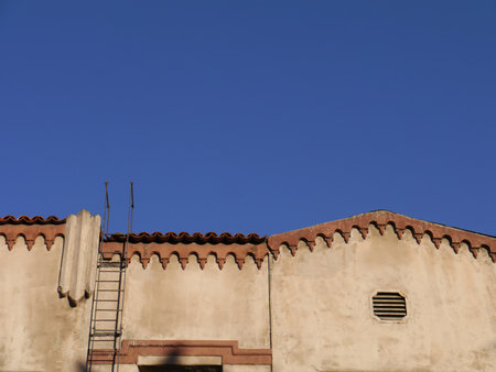Fire escape ladder offers a rooftop escape from danger. Hollywood, CA 2012.のeditorial素材