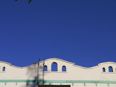 Fire escape ladder offers a rooftop escape from danger. Hollywood, CA 2012.のeditorial素材