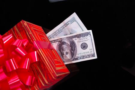 Red gift on black. High resolution. 3D renderの写真素材