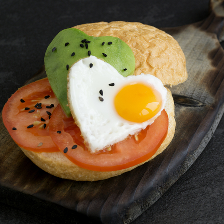 Breakfast on Valentine's day. sandwich with egg and avocado.
の写真素材