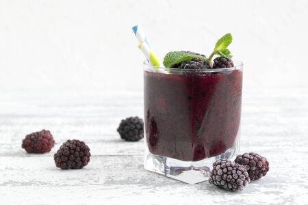 Smoothie of blackberries and currants. on white background.の写真素材