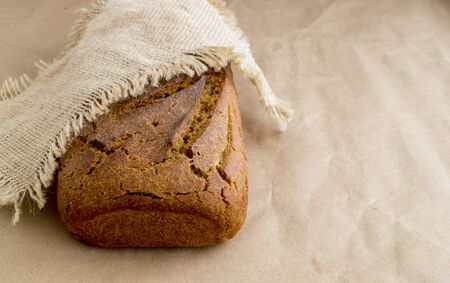 Homemade rye bread on brown paper. Healthy food.
の写真素材