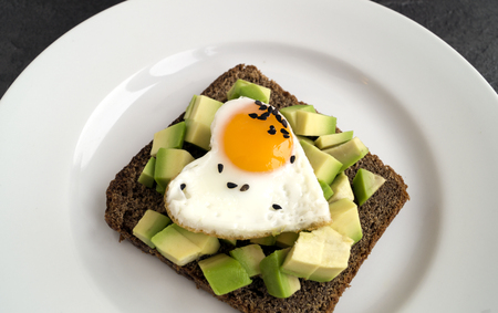 Breakfast on Valentine's day. sandwich with egg and avocado.
の写真素材