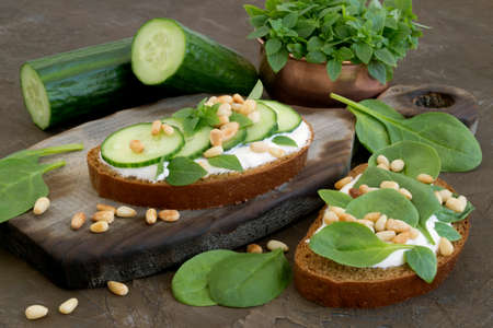 Rye bread with cucumber and pine nuts.の写真素材