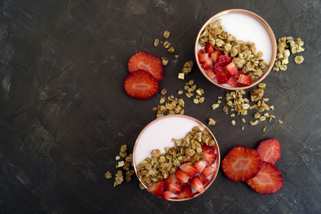 Homemade natural yogurt with strawberries and muesli.の写真素材
