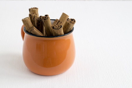 Spicy cinnamon sticks on white background.の写真素材