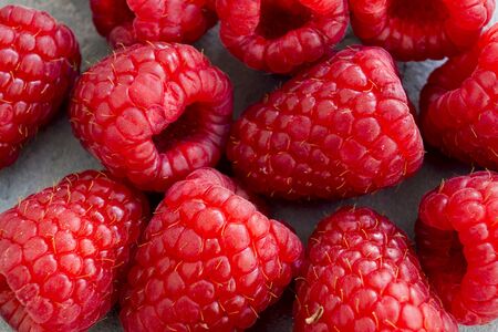 Fresh red raspberries on the table, close up.