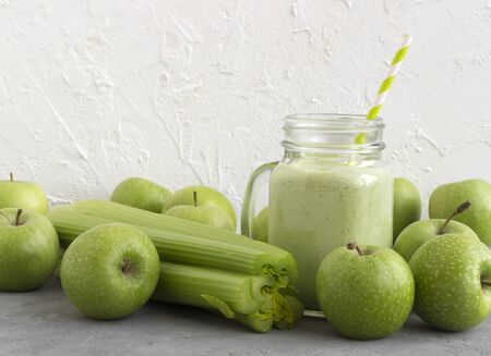 Healthy detox green smoothie in a mason jar.の写真素材