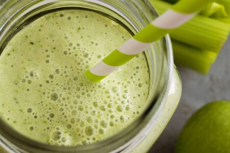 Healthy detox green smoothie in a mason jar.の写真素材
