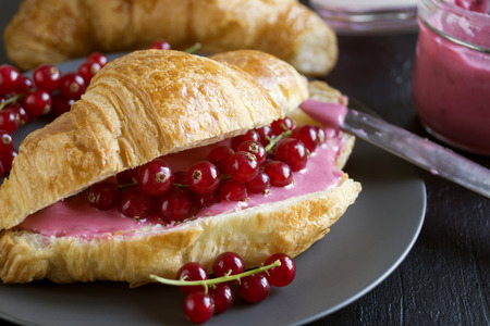 Croissants with jam and berries for Breakfast.の写真素材
