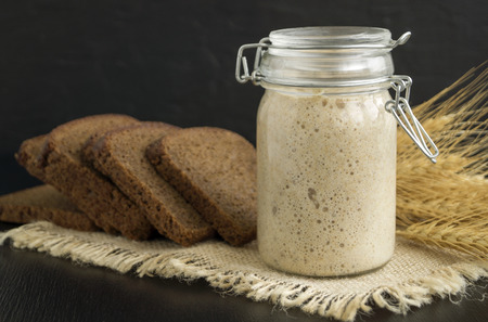 Active rye sourdough in a glass jar for homemade bread.の写真素材