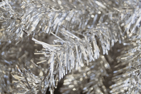 Artificial silver tree close-up. Christmas backgroundの写真素材