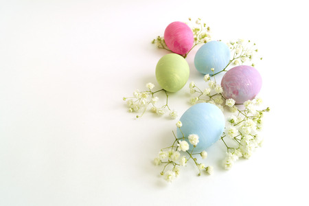 Easter color painted eggs on a white background.