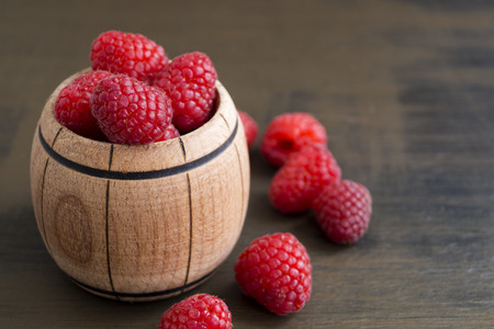 Fresh red raspberries on the table, close up.