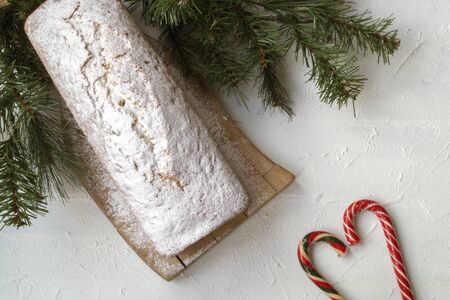 Traditional fruit cake for Christmas with raisins, nuts. with Christmas background.