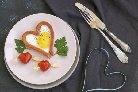 Valentine's day Breakfast is scrambled eggs with heart-shaped bread. The view from the topの写真素材