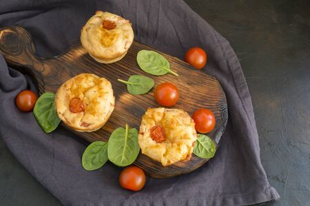 homemade cheese muffins on a dark background.の写真素材
