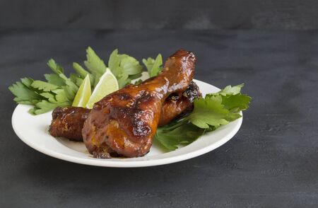 chicken legs fried in sweet and sour sauce with sesame seeds
の写真素材
