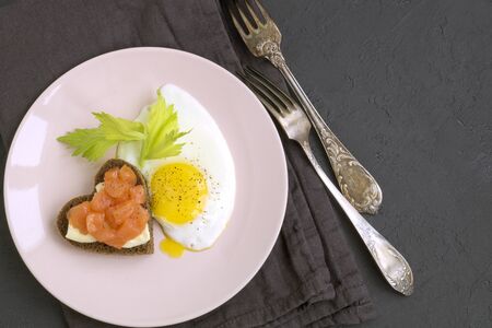 romantic Breakfast for Valentine's day. fried eggs and salmon toast.
の写真素材