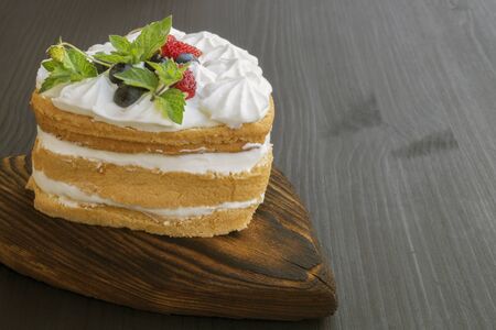 dessert for Valentine's day. homemade cake with cream and wild berries