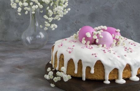 Easter food. Easter cakes and painted eggs. in pink tones.