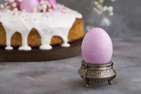 Easter food. Easter cakes and painted eggs. in pink tones.