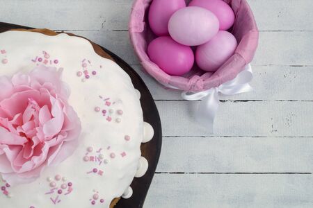 Easter food. Easter cakes and painted eggs. in pink tones.