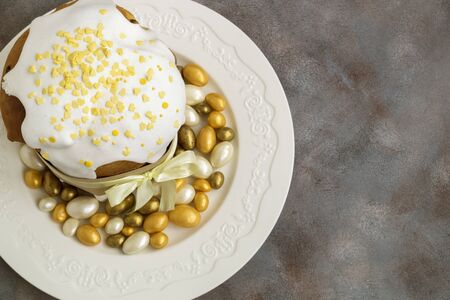 Easter food. Easter cakes and painted eggs. in yellow tones.