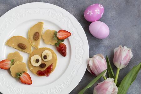 Easter Breakfast. pancakes in the shape of bunnies and Easter eggs.
