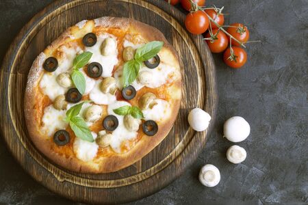 Traditional Italian dish, delicious pizza with mushrooms.の写真素材