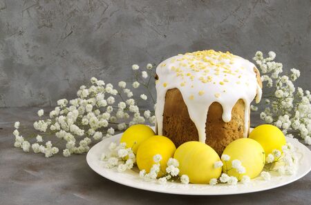 yellow painted Easter eggs on a gray background.の写真素材
