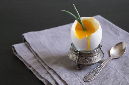 soft-boiled egg. delicious healthy Breakfast. in the egg rackの写真素材